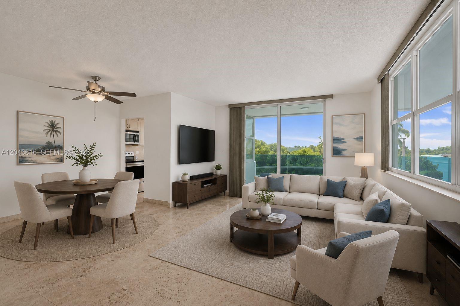 A living and dining area features tile floors, a sectional sofa, and a balcony view — 2639 N Riverside Dr # 206, Pompano Beach FL 33062, POMPANO BEACH, FL