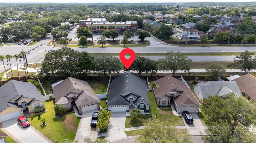 An aerial view shows a residential street with houses, a red location pin, and a road — 12868 GETTYSBURG CIRCLE, ORLANDO, FL