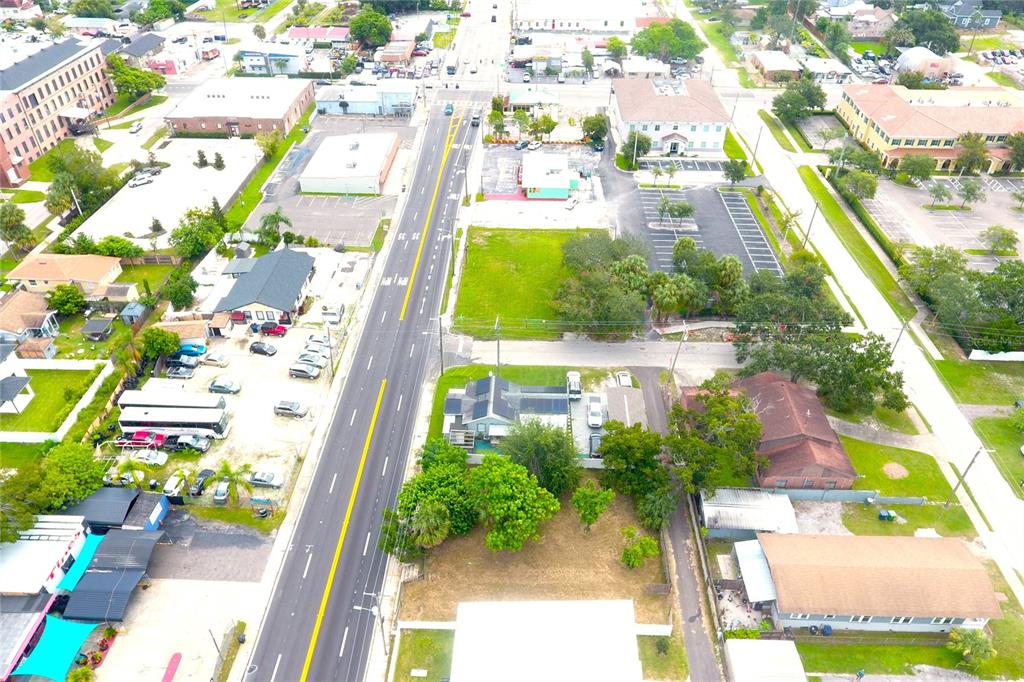 An aerial view shows a multi-lane road passing through a commercial and residential area — 2606 W COLUMBUS DRIVE, TAMPA, FL
