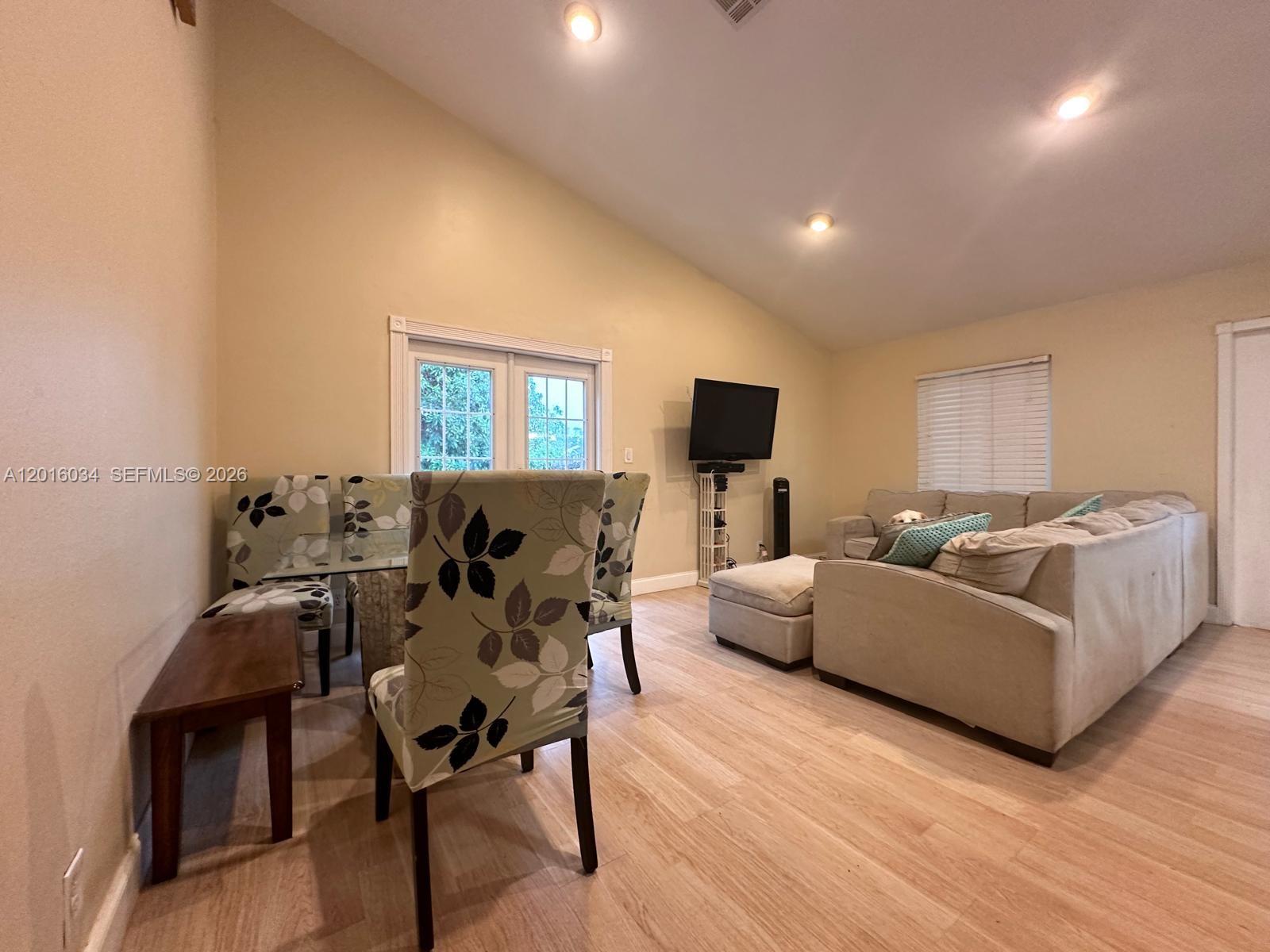A single-story house features a brown garage, a white mailbox, and a large palm tree — 11143 E Model Cir E, Boca Raton FL 33428, BOCA RATON, FL