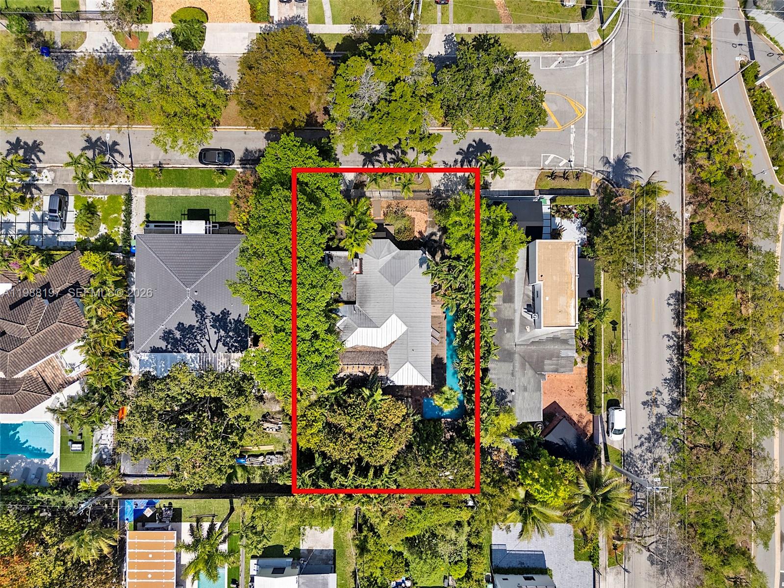 An aerial view shows a house with a metal roof, a pool, and dense landscaping — 120 SW 24th Rd, Miami FL 33129, MIAMI, FL