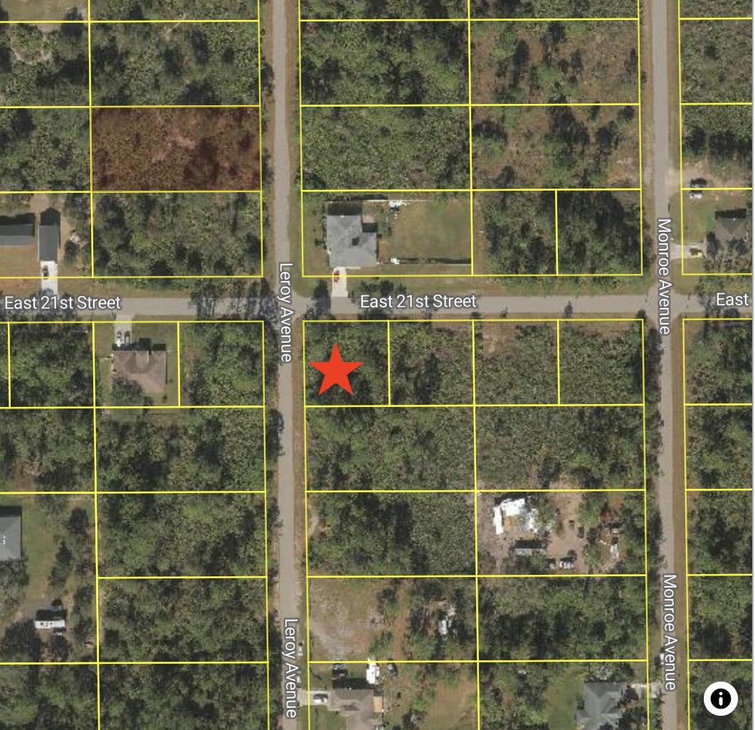 This aerial map shows a vacant, wooded lot marked with a red star — 3700 E 21st Street, FL 33920, FL