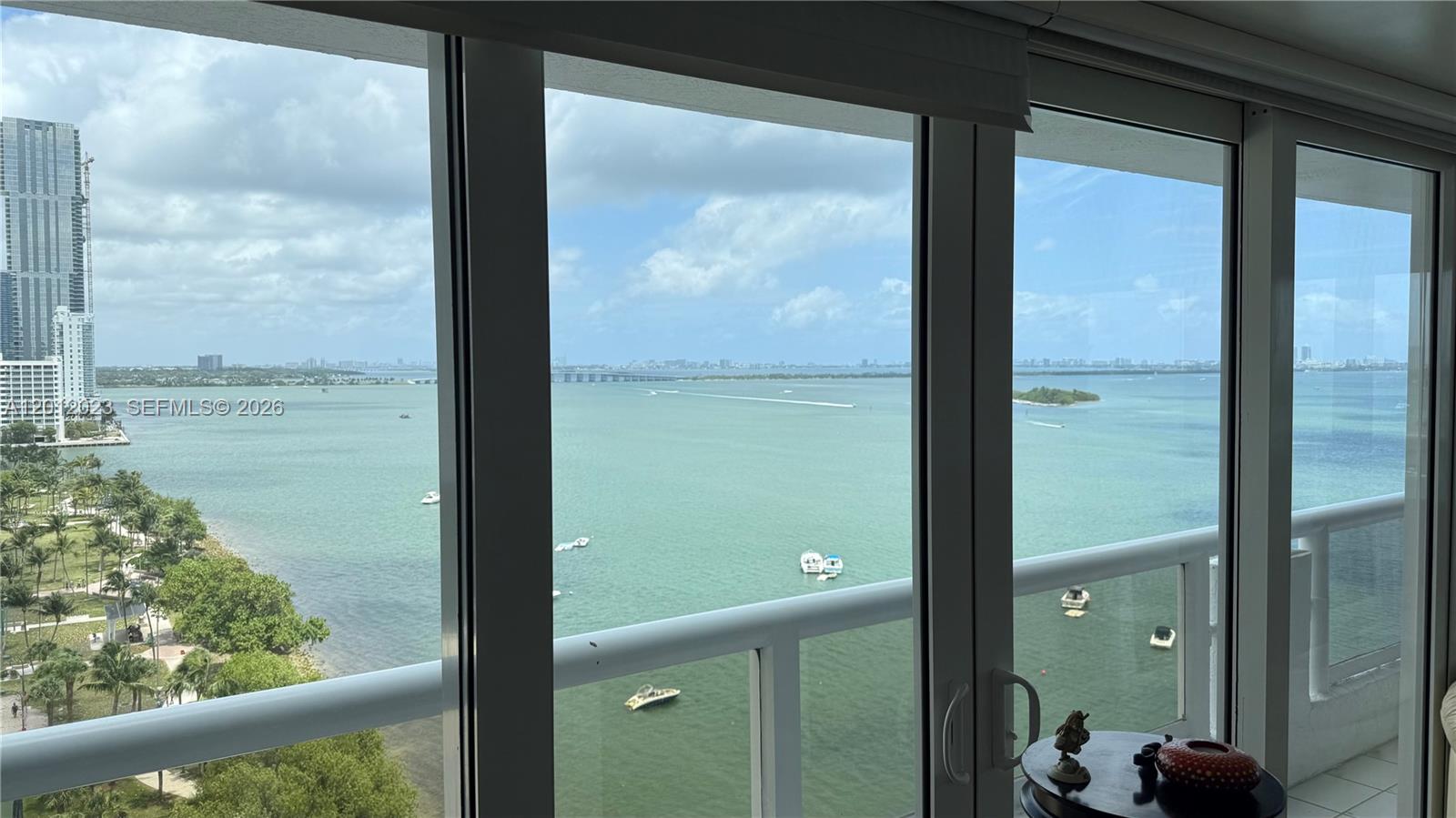 A view of the bay and city skyline from a high-rise balcony — 1717 N Bayshore Dr # 1734, Miami FL 33132, MIAMI, FL
