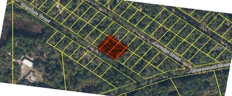 An aerial map view shows a highlighted vacant lot situated between residential streets — 126 and 128 GRANDALE STREET, GEORGETOWN, FL