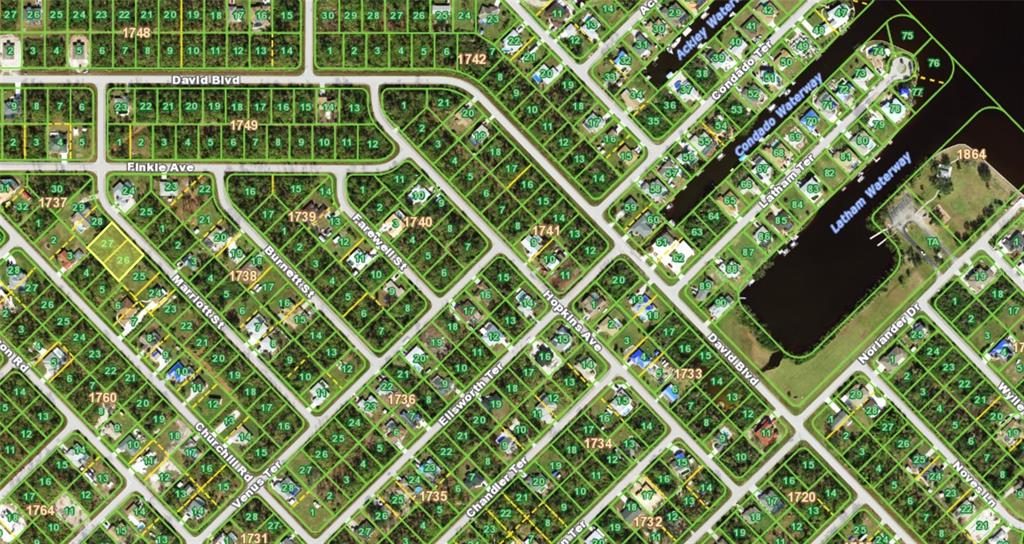 This is a satellite map view showing residential lots, streets, and waterways in a neighborhood — 5153 MARRIOTT STREET, PORT CHARLOTTE, FL