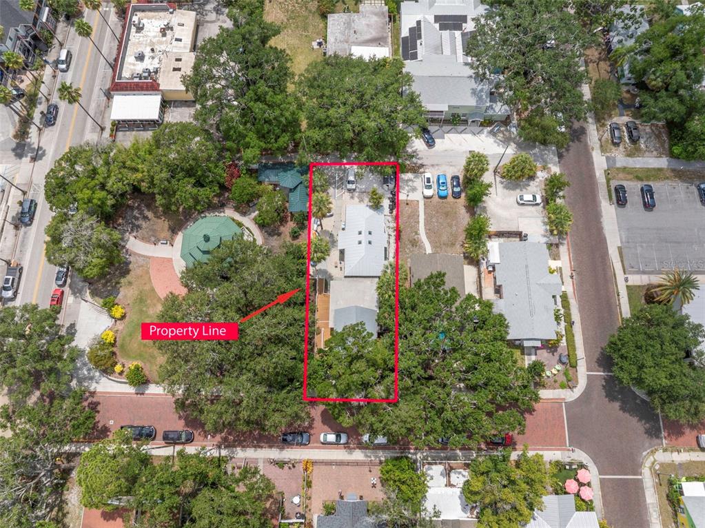 An aerial view shows a rectangular property outlined in red next to a public park — 135 4TH AVENUE N, SAFETY HARBOR, FL
