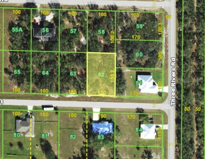 This is an aerial map showing a highlighted vacant lot numbered 62 among surrounding properties — 31122 PEACE STREET, PUNTA GORDA, FL