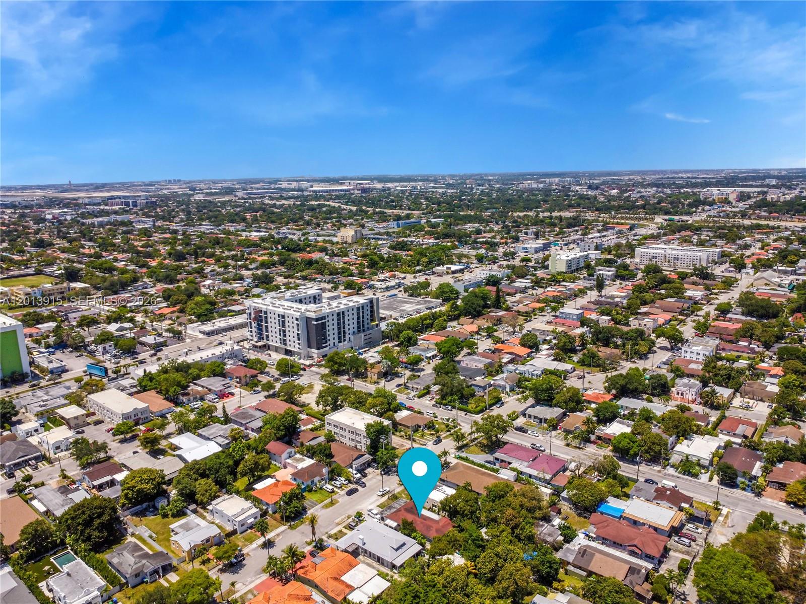An aerial view shows a residential neighborhood with a blue location pin marking a house — 201 NW 25th Ave, Miami FL 33125, MIAMI, FL