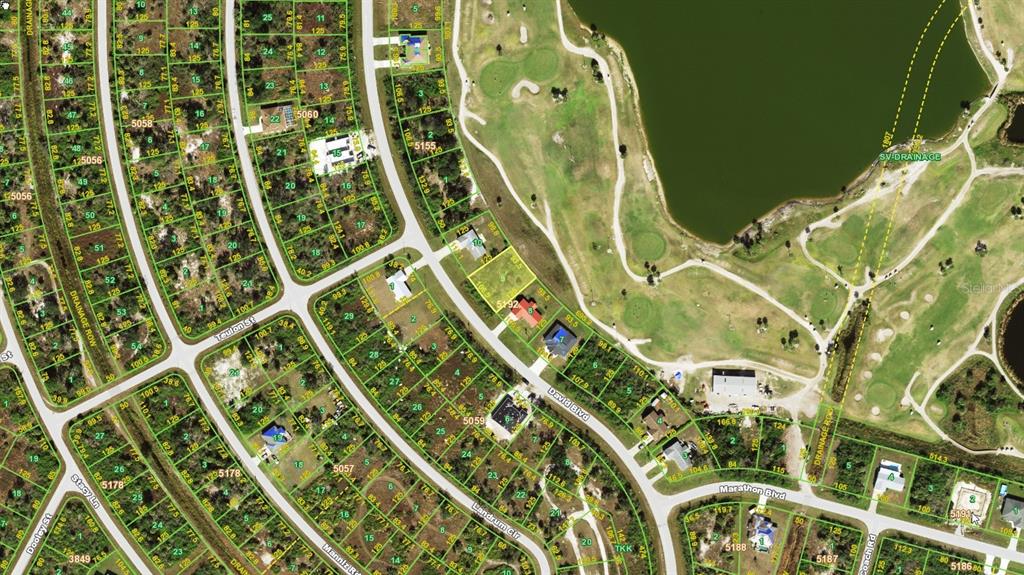 This is an aerial map showing residential lots, streets, and a golf course — 7310 DAVID BOULEVARD, PORT CHARLOTTE, FL