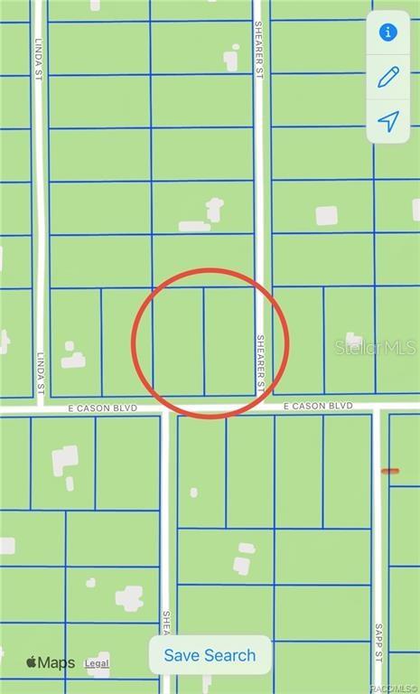 This is a map showing two adjacent vacant lots highlighted by a red circle — SHEARER, INGLIS, FL