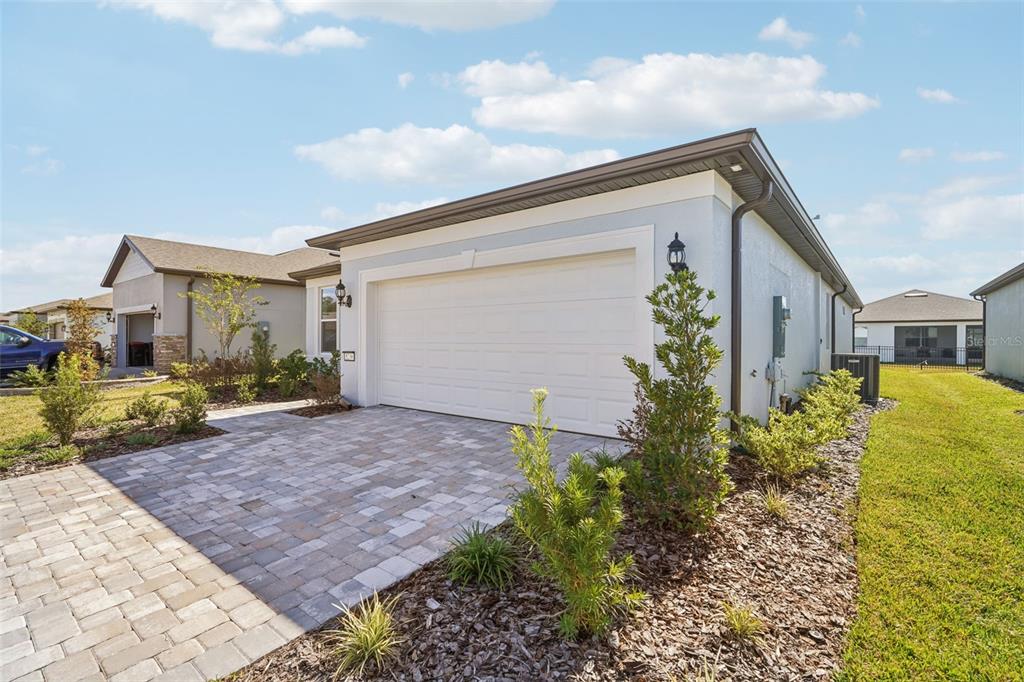 A light blue single-story house with a white garage door and a paved driveway — 5236 SW 88TH CIRCLE, OCALA, FL