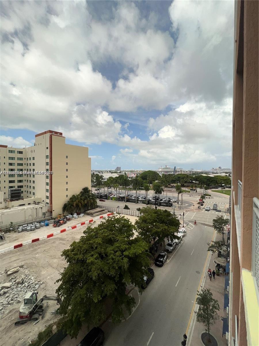 An elevated view shows a street intersection, a construction site, and a large cruise ship — 244 Biscayne Blvd # 643, Miami FL 33132, MIAMI, FL