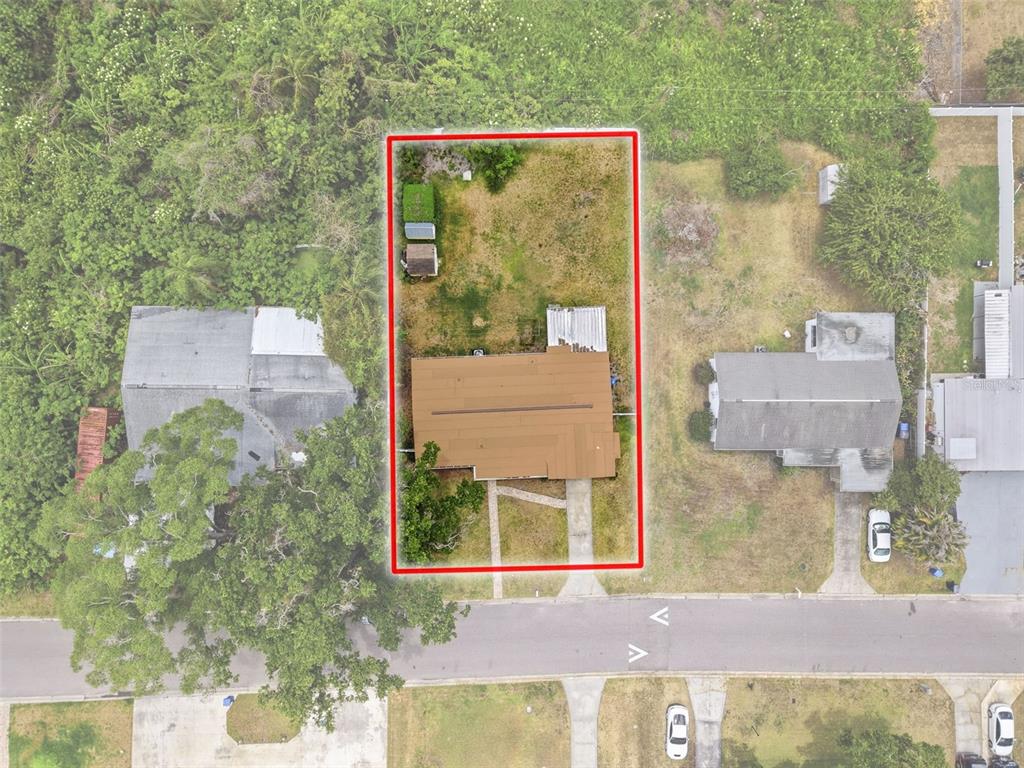 An aerial view shows a house with a brown roof on a rectangular lot — 2518 W NORTH STREET, TAMPA, FL
