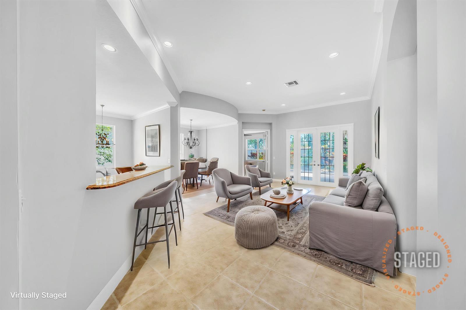 A living room with light tile floors, gray furniture, and a breakfast bar area — 6581 Southport Drive, Boynton Beach FL 33472, BOYNTON BEACH, FL