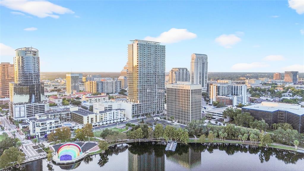 An aerial view of the Orlando skyline featuring Lake Eola and the iconic rainbow bandstand — 150 E ROBINSON STREET UNIT 3106, ORLANDO, FL