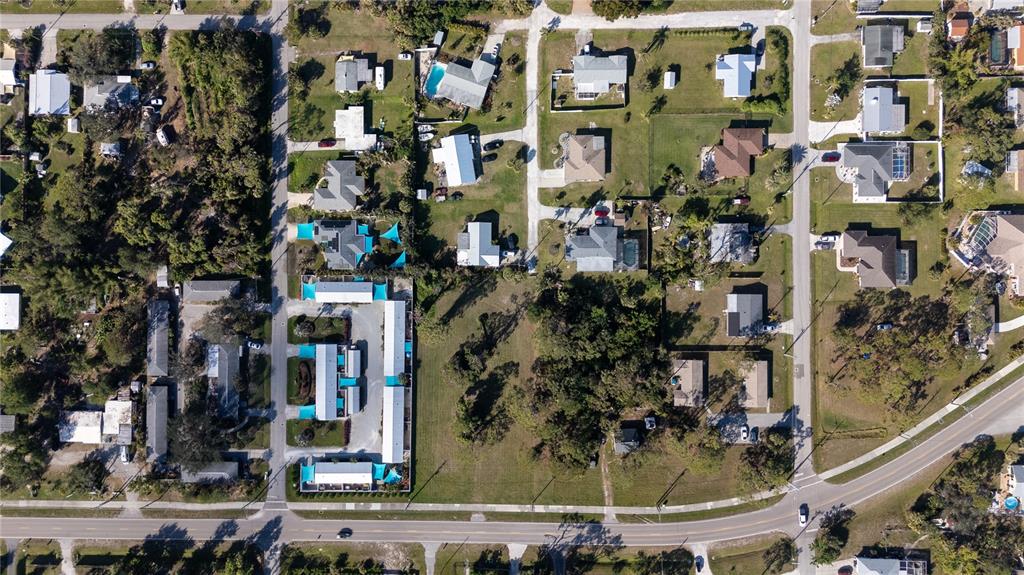 This aerial view shows a residential neighborhood with houses, a multi-unit complex, and roads — OLD ENGLEWOOD ROAD, ENGLEWOOD, FL