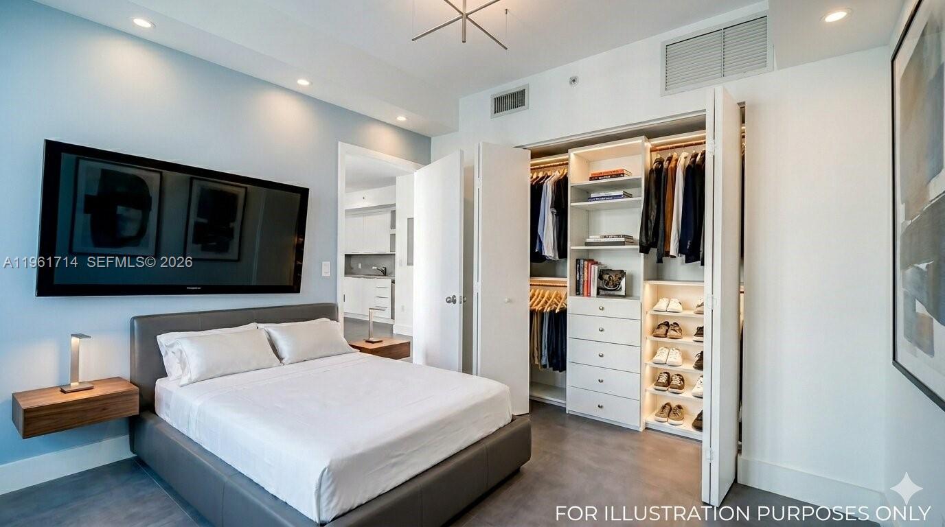 A modern bedroom features a bed, a wall-mounted television, and an open walk-in closet — 90 SW 3rd St, Miami FL 33130, MIAMI, FL