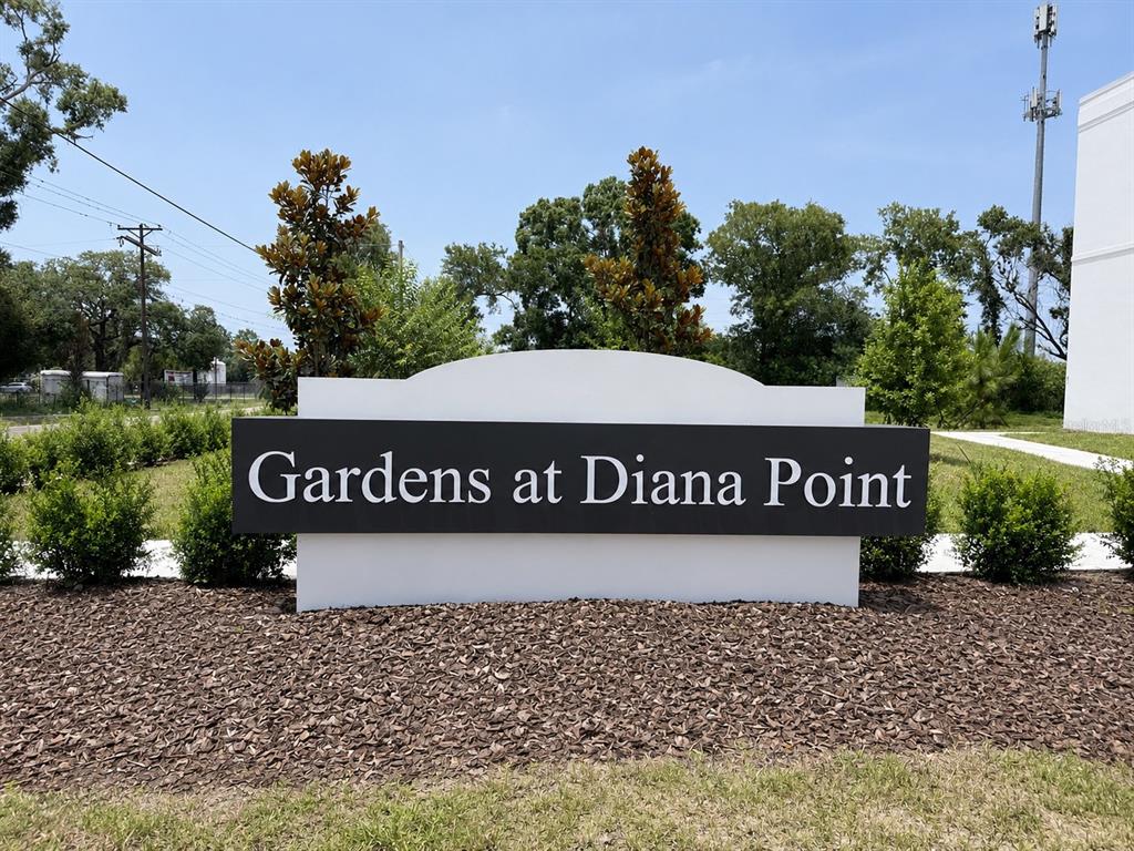 A white and black monument sign reads Gardens at Diana Point in a landscaped area — 4349 CAMBIO GARDENS CT, TAMPA, FL