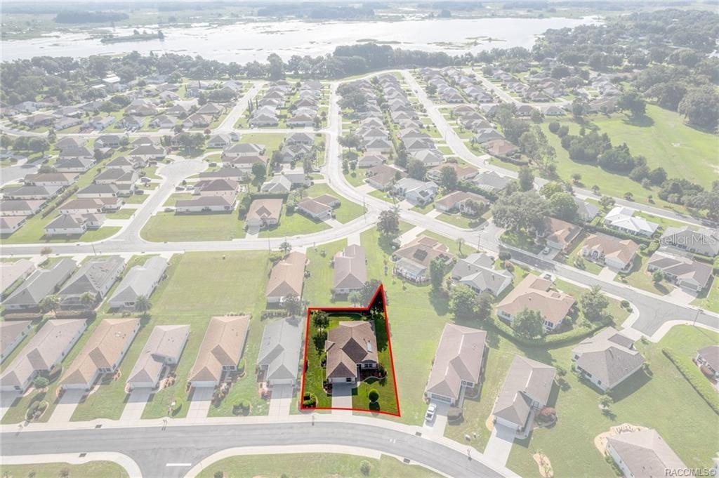 An aerial view shows a single-story house with a red outline on a suburban lot — 4658 N LAKE VISTA TRAIL, HERNANDO, FL