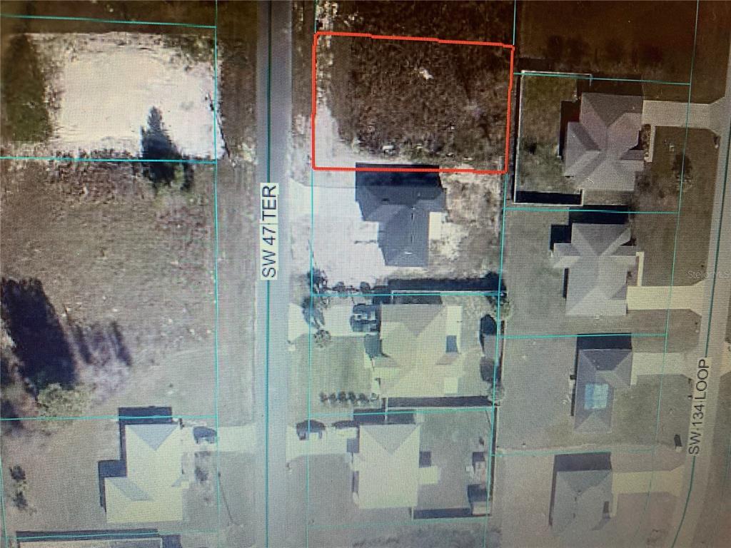 This is an aerial map showing a vacant residential lot outlined in red — TBD SW 47 TER, OCALA, FL