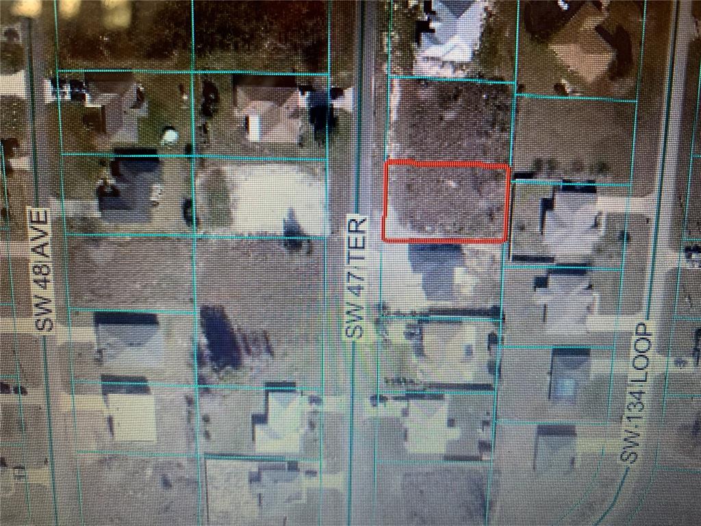 This is an aerial map showing a vacant lot outlined in red within a residential neighborhood — TBD SW 47 TER, OCALA, FL
