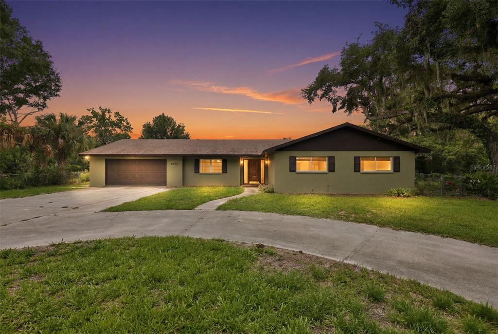 A screened-in swimming pool area features a wood-paneled ceiling and a concrete patio — 4475 CYPRESS COUNTRY LANE, LAKELAND, FL