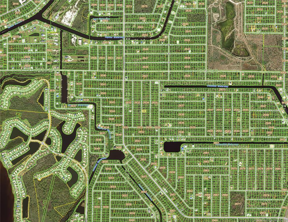 This is an aerial map showing a residential neighborhood with streets, canals, and wooded areas — 2136 CHAFFEE STREET, PORT CHARLOTTE, FL