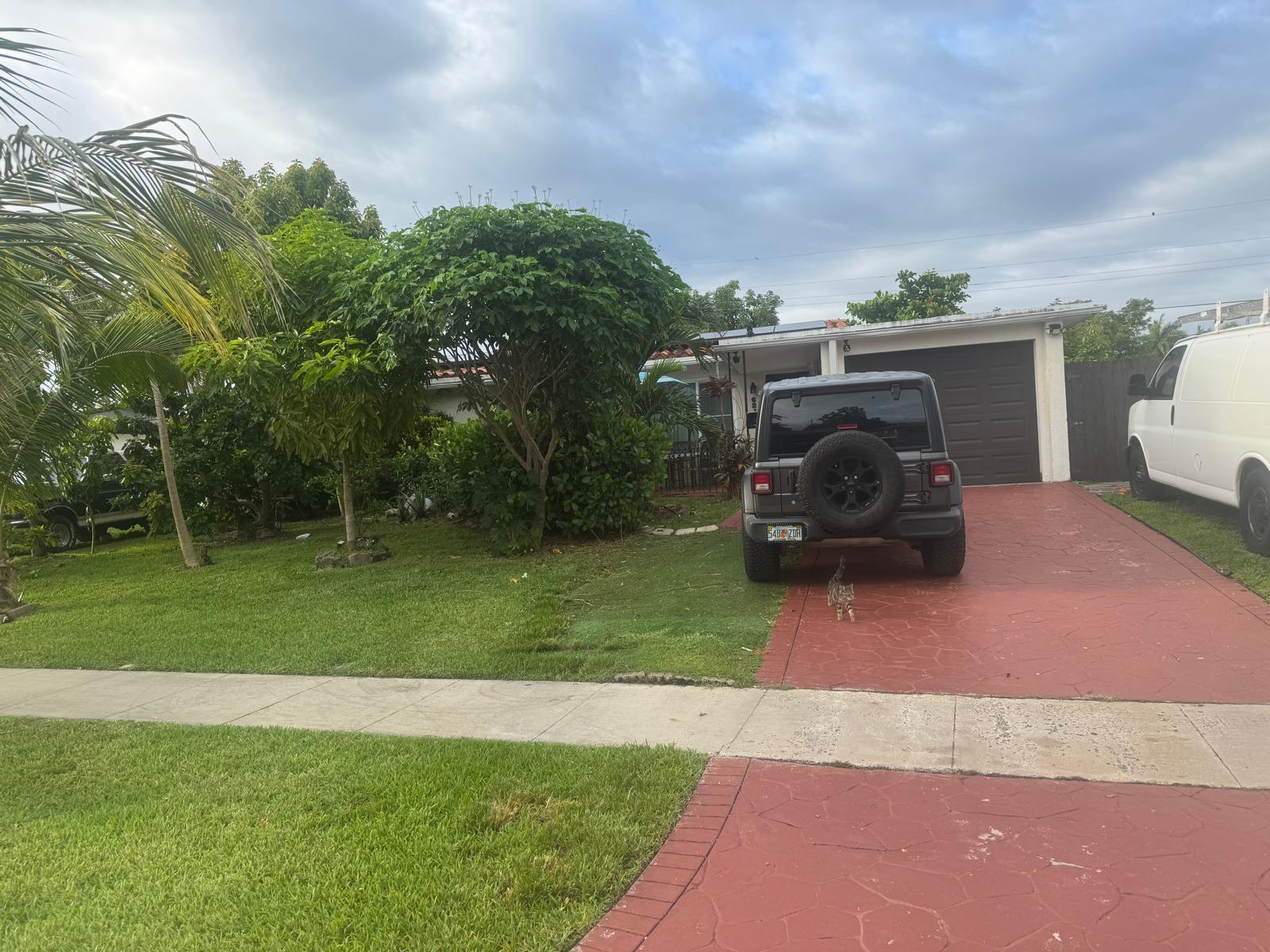 A gray Jeep is parked on a red driveway in front of a single-story house — 6218 NW 17th Street, Margate FL 33063, MARGATE, FL