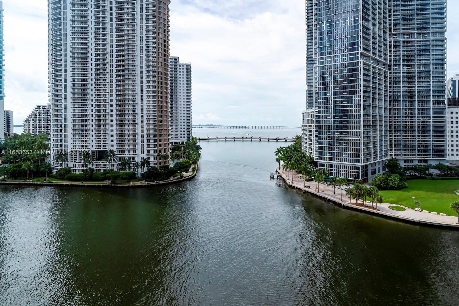 An aerial view of a waterway between two tall residential high-rise buildings in Miami — 300 Biscayne Blvd Way # 902, Miami FL 33131, MIAMI, FL