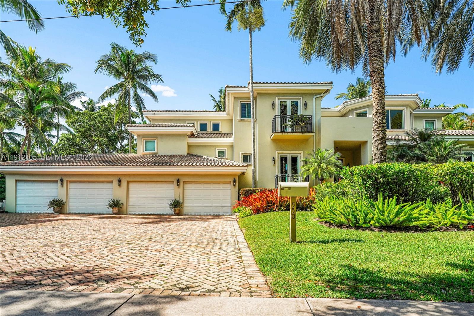 An aerial view shows a residential property highlighted by a yellow outline amidst lush vegetation — 550 Harbor Dr, Key Biscayne FL 33149, KEY BISCAYNE, FL