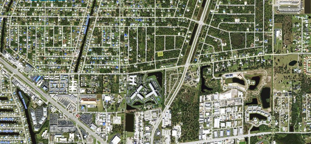 This aerial map shows a highlighted vacant lot within a residential neighborhood — 23149 KELLETT AVENUE, PUNTA GORDA, FL