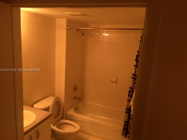 A bathroom features a white toilet, a vanity with a sink, and a shower-tub combination — 816 NW 11th St # 1104, Miami FL 33136, MIAMI, FL