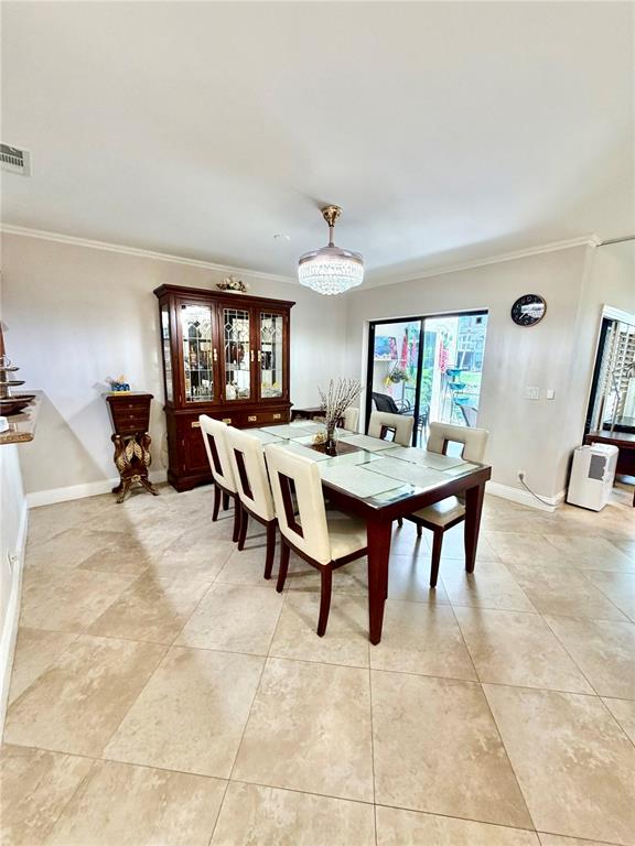 A dining room features a dark wood hutch, a six-chair table, and light tile flooring — 6075 GLENDALE DRIVE, BOCA RATON, FL