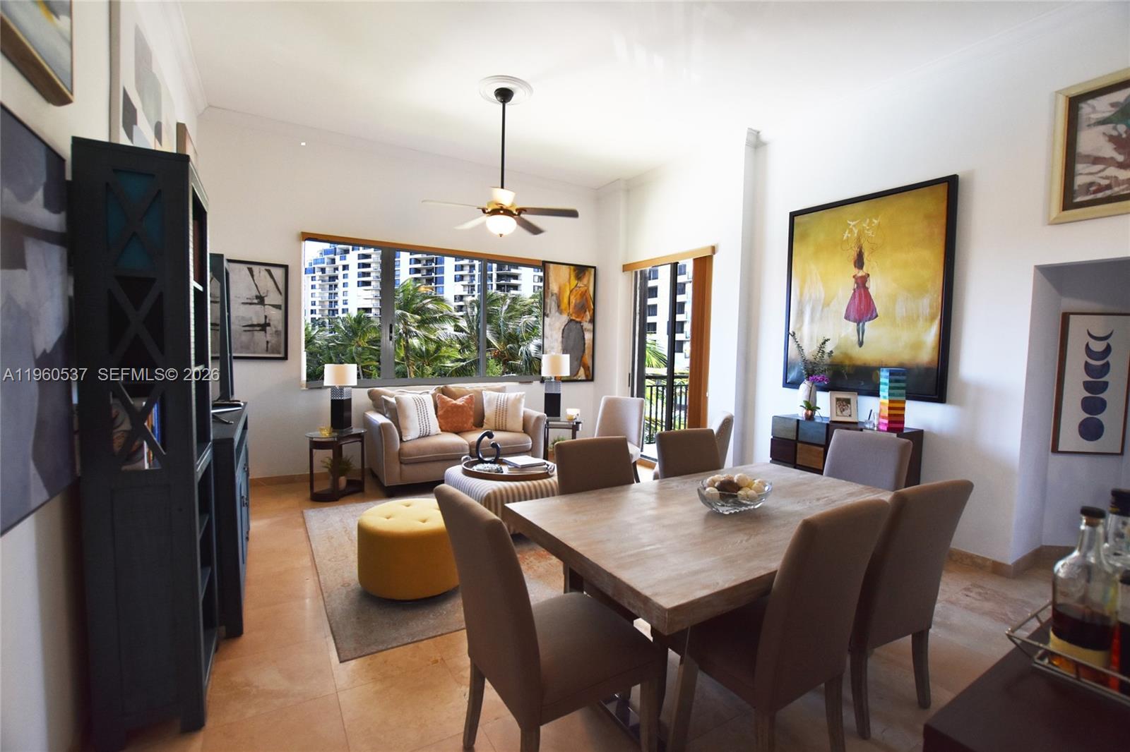 A living and dining area features tile floors, a ceiling fan, and large windows — 540 Brickell Key Dr # 505, Miami FL 33131, MIAMI, FL
