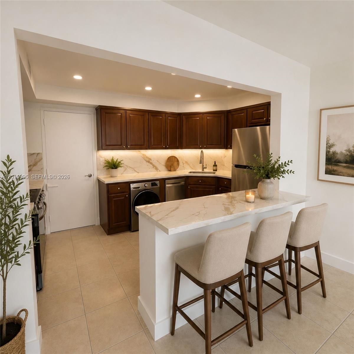 An empty room with beige tile flooring features a large window wall overlooking the water — 1408 Brickell Bay Dr # 1104, Miami FL 33131, MIAMI, FL