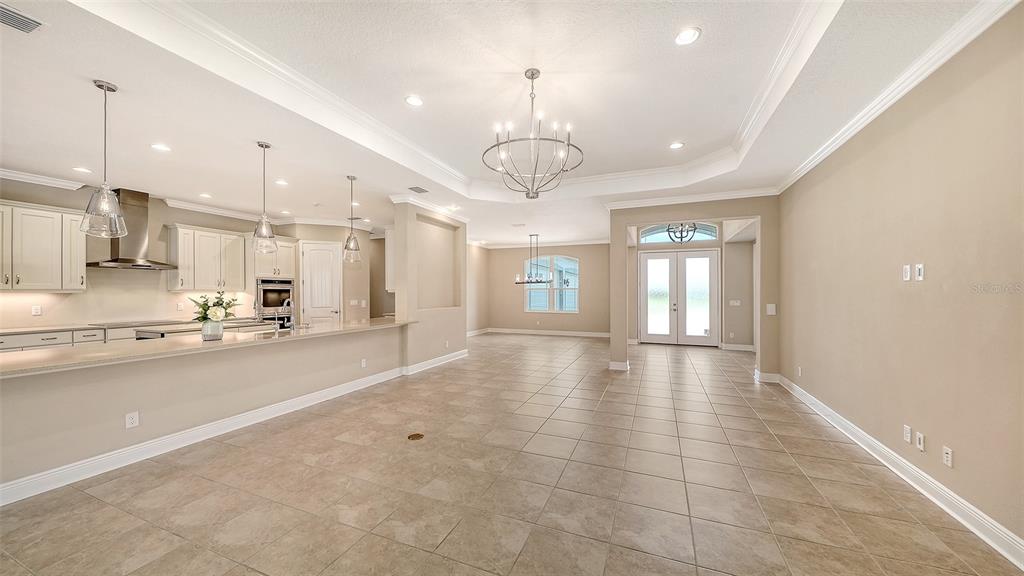 An aerial view shows a large, grassy residential lot outlined in white with scattered trees — 3503 RECURVE CIRCLE, SARASOTA, FL