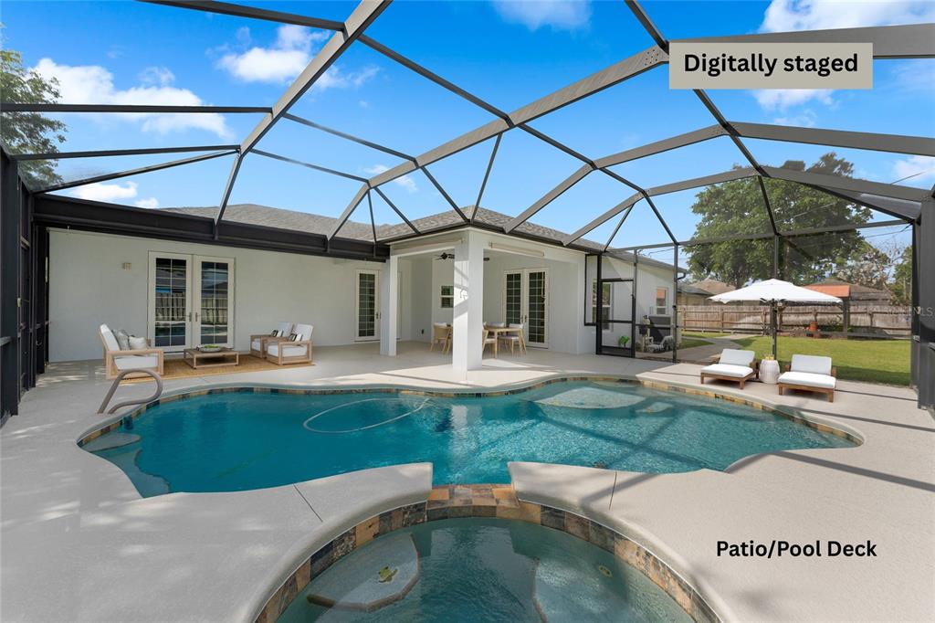 A screened-in patio features a swimming pool, a hot tub, and outdoor furniture — 2943 TOULON ROAD SE, PALM BAY, FL