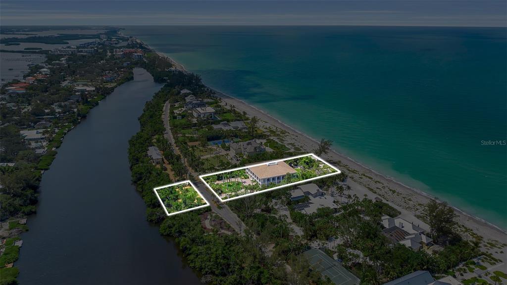 An aerial view shows a beachfront property with a large house and adjacent wooded lot — 8132 SANDERLING ROAD, SARASOTA, FL
