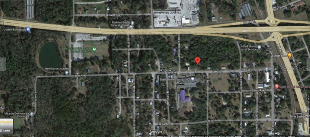 This is a satellite map view of a residential area in Hawthorne, Florida — 104 NW 3RD AVENUE, GAINESVILLE, FL