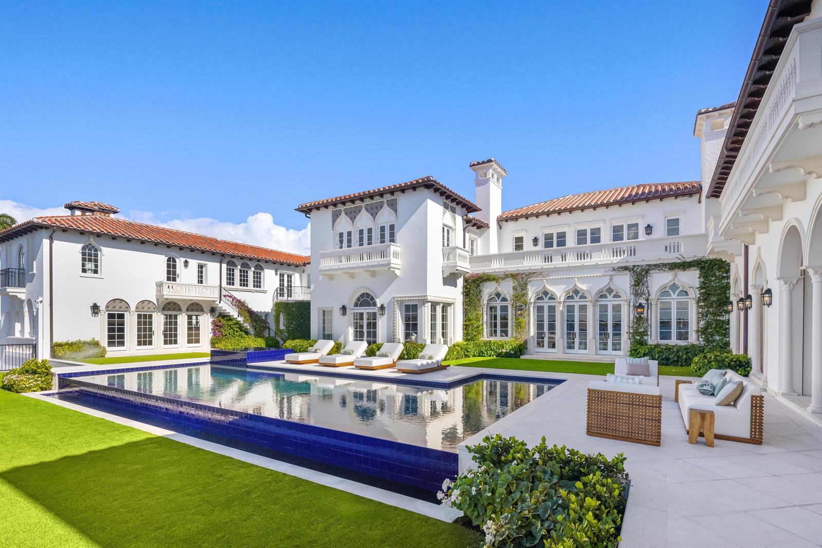 A large white Mediterranean-style mansion features a swimming pool, patio, and manicured lawn — 800 S County Road, Palm Beach FL 33480, PALM BEACH, FL