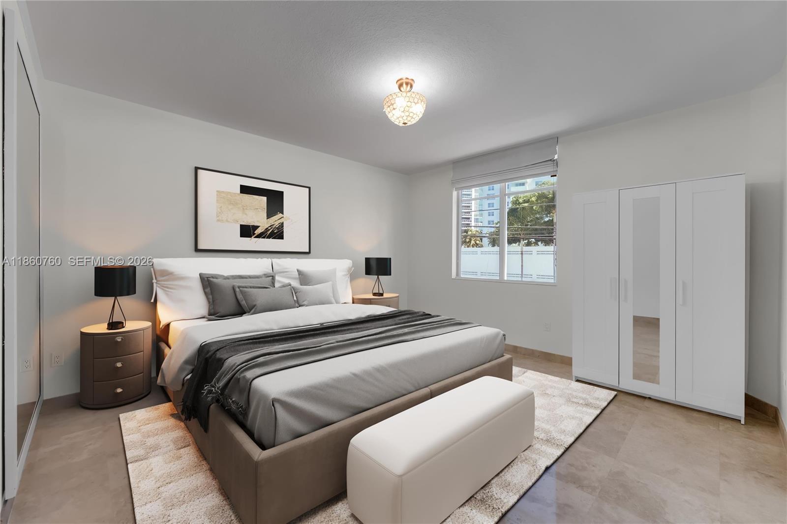 A bedroom features a bed with gray bedding, two nightstands, a white wardrobe, and tile flooring — 1 Century Ln # 202, Miami Beach FL 33139, MIAMI BEACH, FL