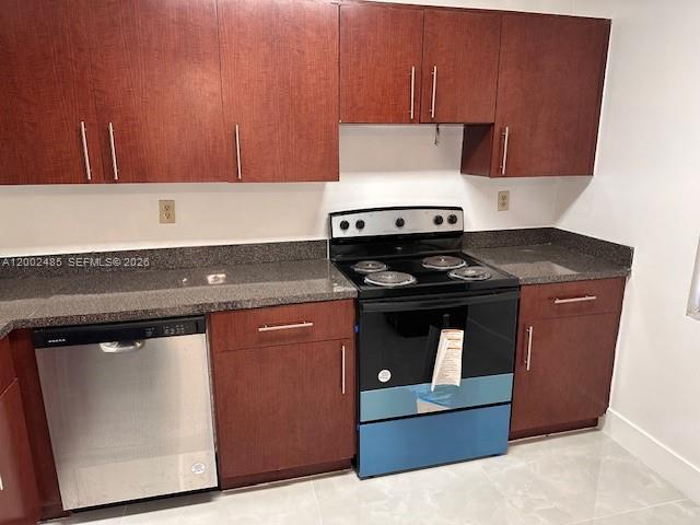 A kitchen features dark wood cabinets, granite countertops, and stainless steel appliances — 5835 W 20th Ave # 106, Hialeah FL 33012, HIALEAH, FL