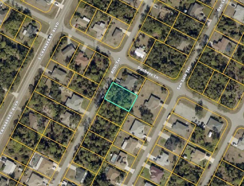 This is an aerial map showing a vacant residential lot highlighted in light blue — Lot #14 ALIBI TERRACE, NORTH PORT, FL