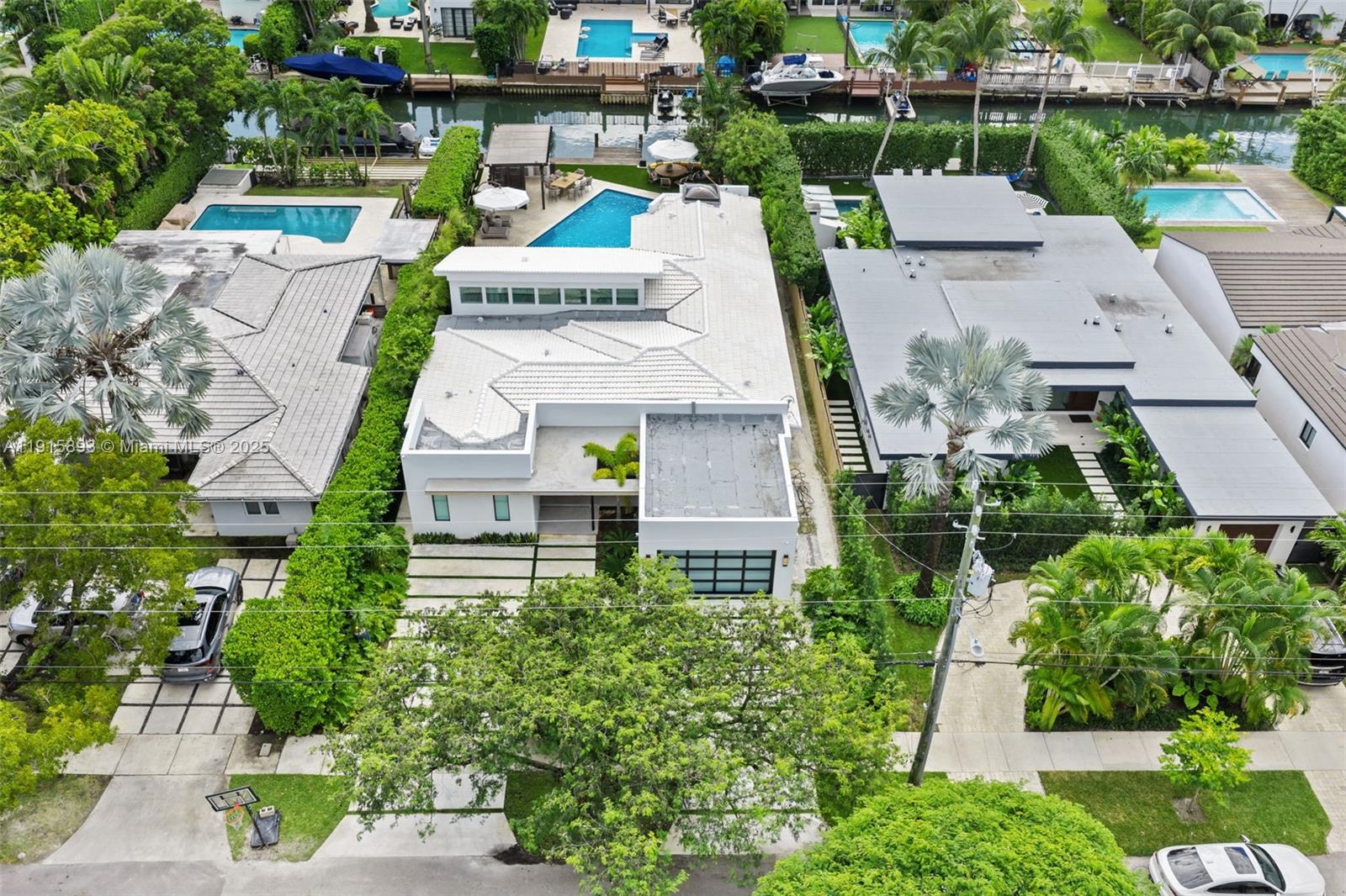 An aerial view shows a white modern house with a pool and a flat roof — 1792 Cleveland Rd, Miami Beach FL 33141, MIAMI BEACH, FL
