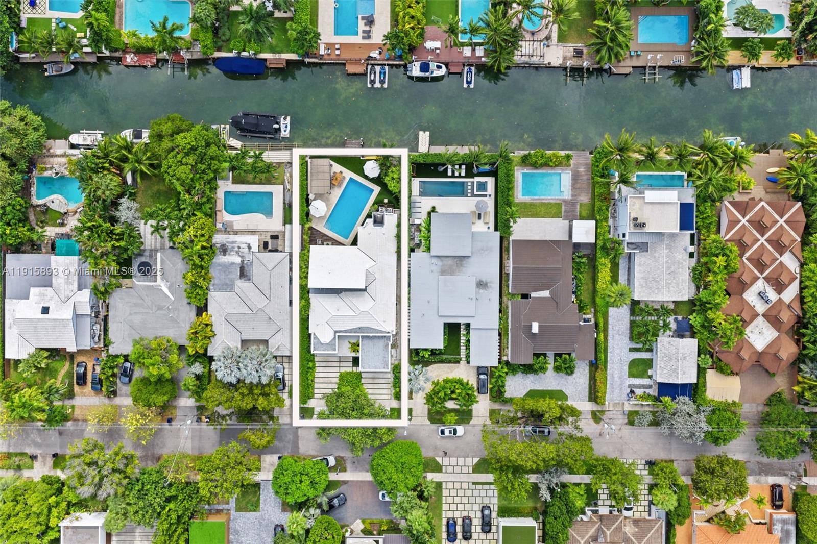 An aerial view shows a waterfront residential property with a swimming pool and private dock — 1792 Cleveland Rd, Miami Beach FL 33141, MIAMI BEACH, FL