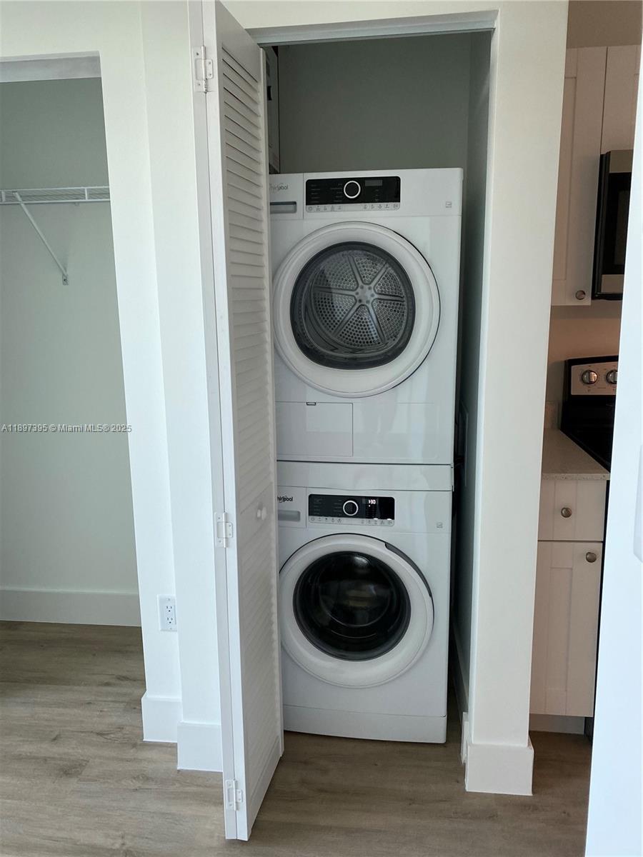 A stacked Whirlpool washer and dryer unit is located inside a closet — 4100 SW 64th Ave # 314, Davie FL 33314, DAVIE, FL