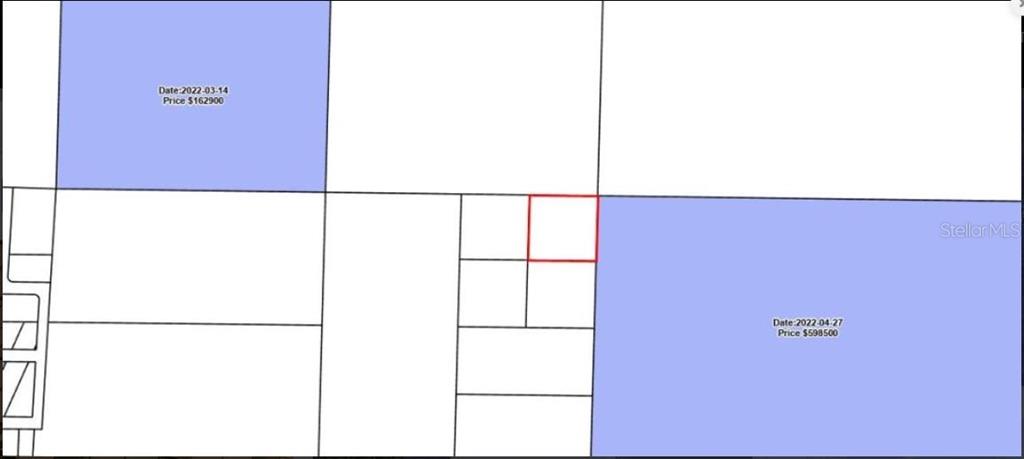 This is a map showing property boundaries with two highlighted lots and a red-outlined parcel — N/A, FOUNTAIN, FL