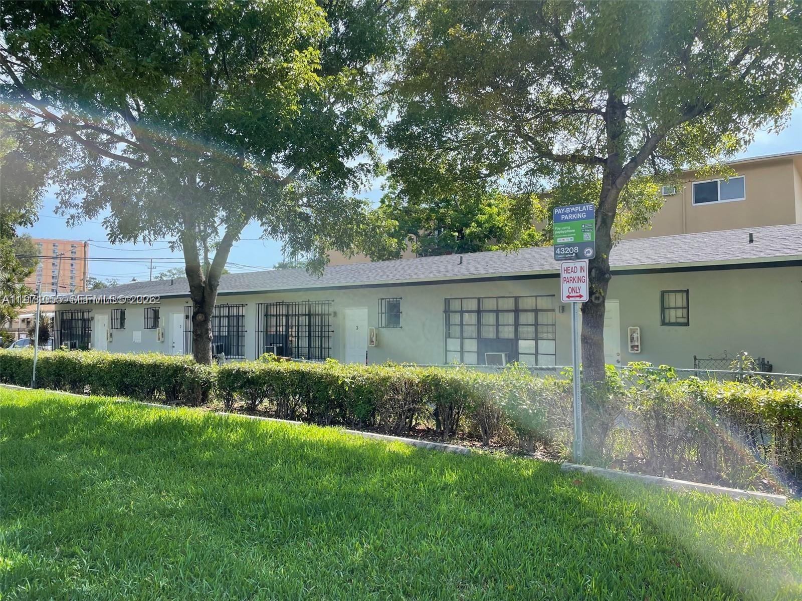 A single-story apartment building with a lawn and parking signage in front — 1346 NW 6th St # 4, Miami FL 33125, MIAMI, FL