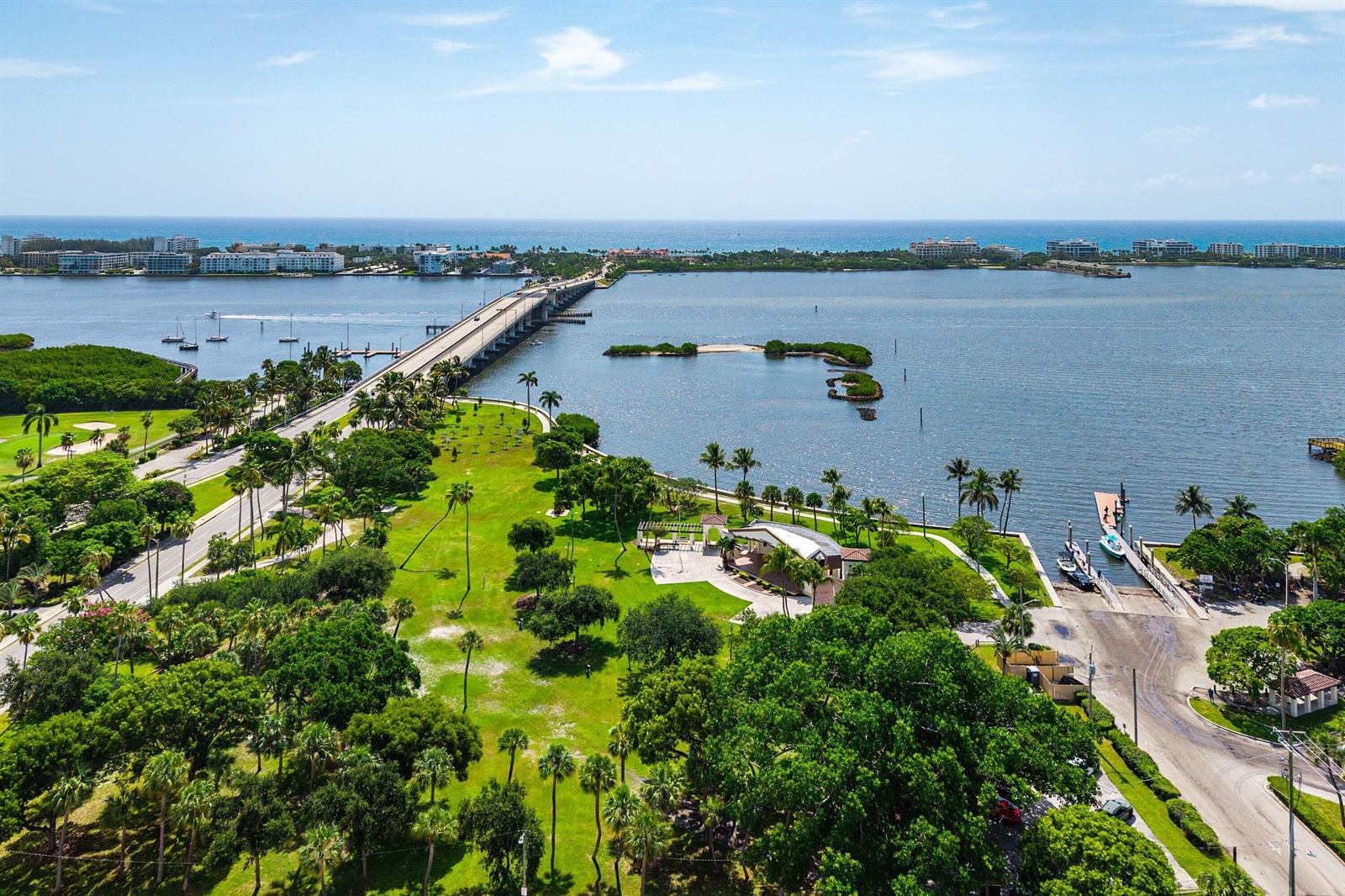 An aerial view shows a park with a pavilion, boat ramp, and bridge over water — 15 S Golfview Road # 206, Lake Worth FL 33460, LAKE WORTH, FL