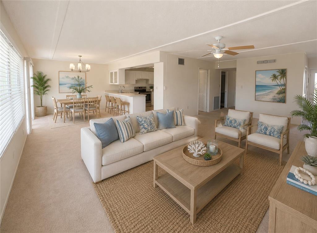 A living room with a sofa, coffee table, and dining area in an open floor plan — 1655 S HIGHLAND AVENUE UNIT D238, CLEARWATER, FL